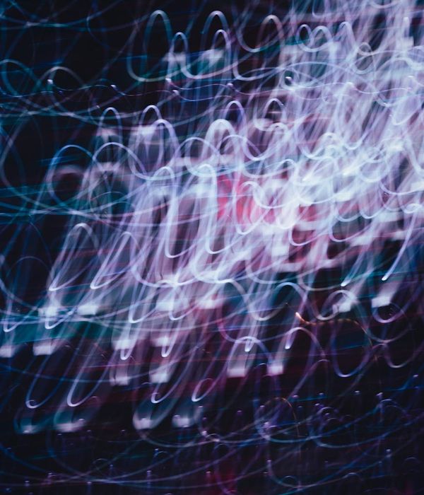 Abstract glowing green lines representing energy flow and rhythm